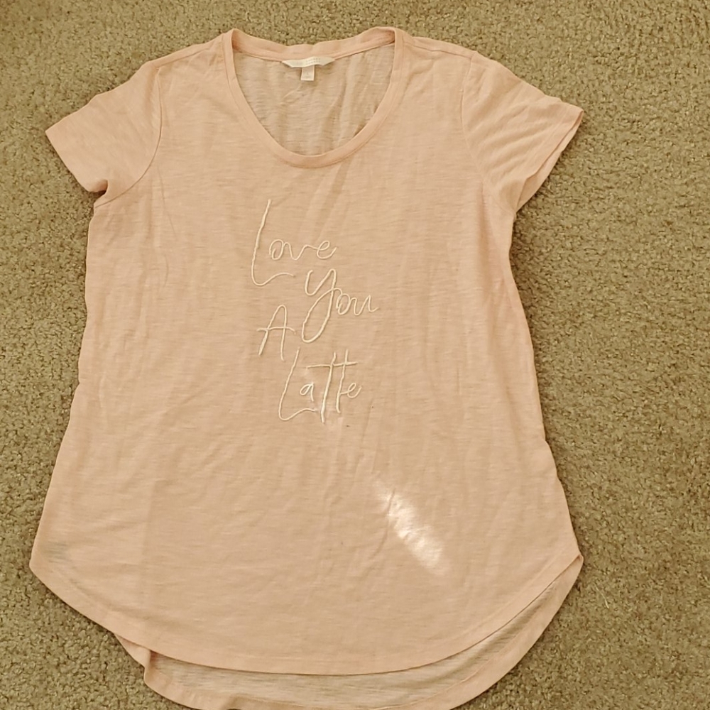 Pink embroidered shirt.
